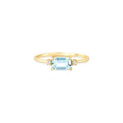 Anel em ouro amarelo com topázio azul retangular 6x4 mm e diamante